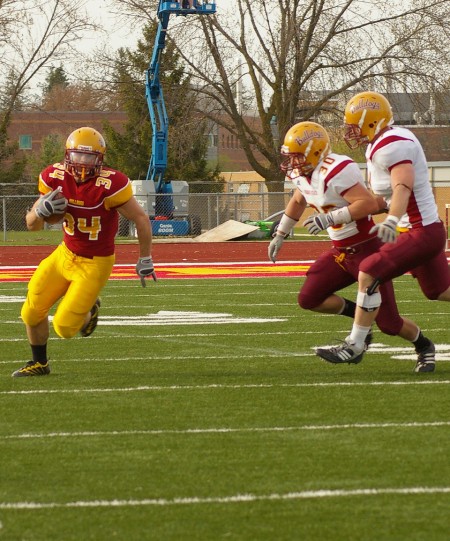 On the Run: Skyler Stoker, Ferris freshman and running back for the Ferris State Bulldogs, runs for the end zone at the Spring Game this weekend. Photo By: Kristyn Sonnenberg | Photo Editor